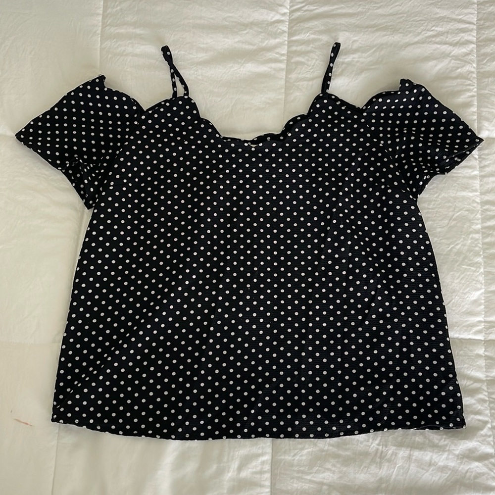 Black shirt with white polka dots
